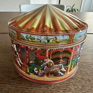 Contenedor de caramelos de hojalata de carrusel vintage Churchill's of London - Imagen 1 de 6
