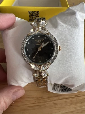 Impresionantes cristales mariposa Invicta oro rosa flor silvestre esfera negra Foto 1 de 4