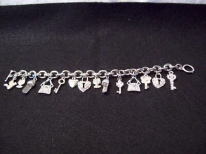 Vintage Bettelarmband silberfarben (15 Charms) - Bild 1 von 2