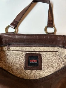 Hobo International Brown Leather Medium Duffle Style Bag w/ Strap and Handles - Picture 1 of 6