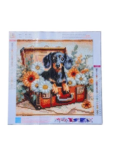Finished Diamond Painting - Dachshund Puppy in Suitcase with Flowers - Picture 1 of 4
