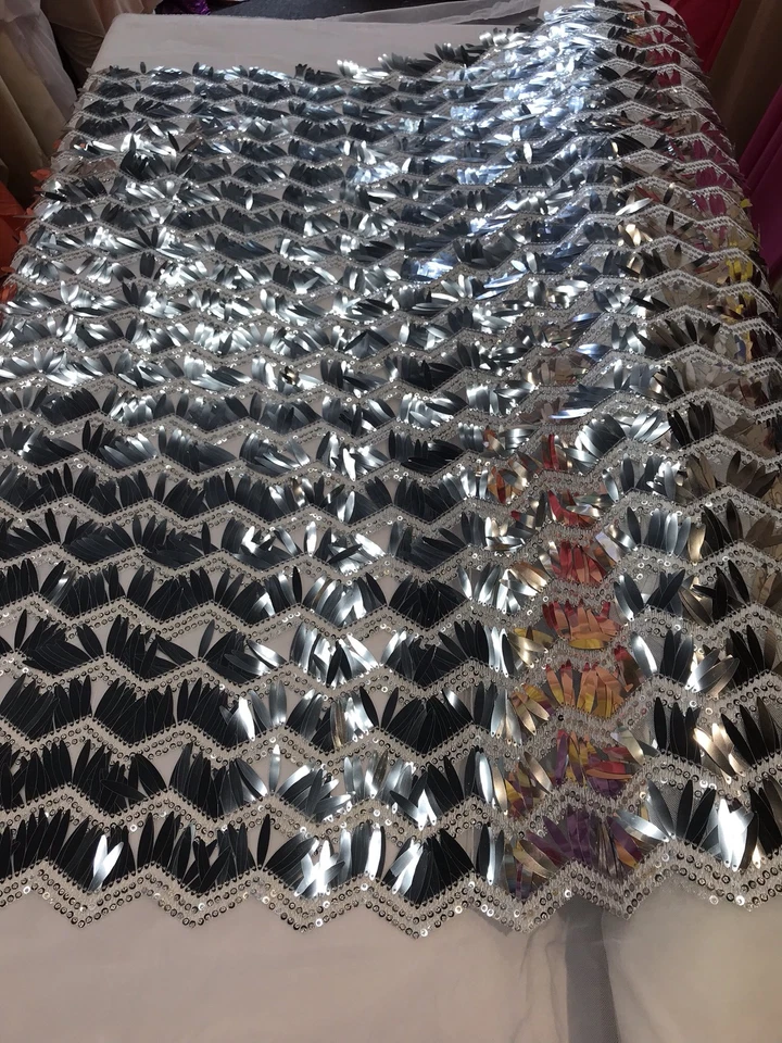 SILVER-WHITE CHEVRON EMBROIDERY WITH LONG SEQUINS ON A MESH-SOLD BY THE YARD. - Image 1 of 4