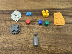 Authentic OEM Nintendo 64 N64 Replacement Controller Buttons Pads Includes Shown - Picture 1 of 1