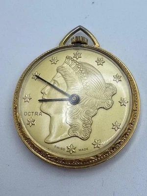 Reloj Colgante Mecánico Vintage Damas OCTRA Hecho en Suiza Moneda Tono Dorado FUNCIONA Foto 1 de 4