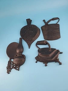 Juego de 4 decoraciones de pared vintage de metal negro de hierro fundido Sexton 1966 para casa de campo - Imagen 1 de 10