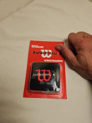 Muñequeras Wilson de raquetball negras y rojas Foto 1 de 3