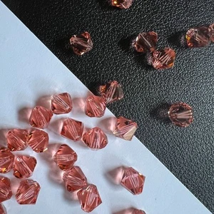 Original Swarovski Kristall Funkelnde Perlen in Rose Pfirsich Doppelkegel Rund Briolette - Bild 1 von 10