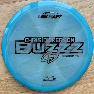 Discraft 2025 Chris Dickerson Tour Series Z Swirl Blend Buzzz 5/4/-1/1 Blue 176g - Image 1 of 4