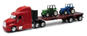 New-Ray 10283 1:32 Peterbilt 387 with Flatbed Hauling a Farm Tractor - Picture 1 of 1