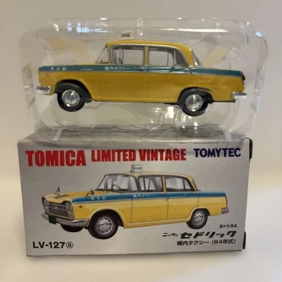 Coche diecast Tomica Limited Vintage Neo LV-127 Nissan Cedric Taxi amarillo azul Foto 1 de 4