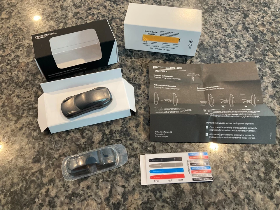 PORSCHE DESIGN OEM 911 AIR FRESHENER DIFFUSER W/URBAN ENERGY SCENT IN DK. GREY - Image 1 of 4