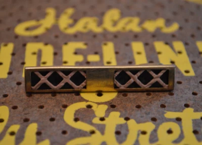 Vintage Gold Tone Anson Tie Clip with Black Back and Pink X's - Image 1 of 4
