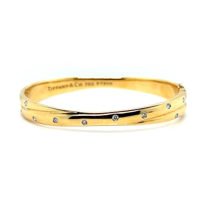 Brazalete cruzado Tiffany & Co oro amarillo 18k platino diamante Etoile 43,40 gramos Foto 1 de 4