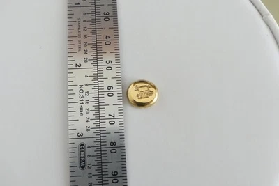Calavera y tibias cruzadas botón oro puro 24k refinado 5 gramos Foto 1 de 4