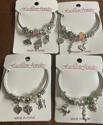 Lote de cuatro brazaletes con cadena de serpiente tono plata y plata Foto 1 de 4