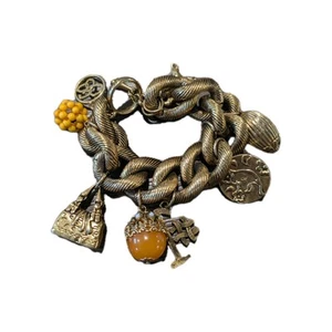 Pulsera Jessica Simpson Gruesa Color Latón Dije Múltiples Dijes - Imagen 1 de 11