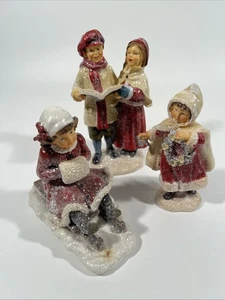 "Juego de 3 estatuillas navideñas niños villancicos trineo resina brillante 6""" - Imagen 1 de 4