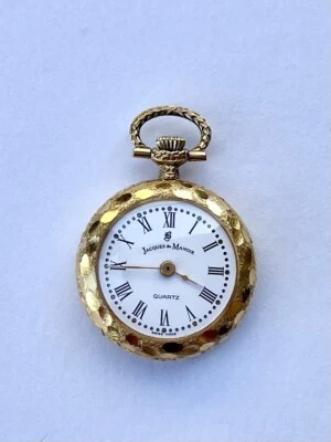VINTAGE JACQUES DU MANOIR SWISS CARVED GOLD TONE PENDANT WATCH - Image 1 of 2