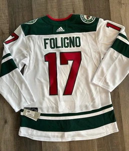 CAMISETA DE HOCKEY ADIDAS MINNESOTA WILD FOLIGNO AUTÉNTICA NUEVA CON ETIQUETAS $300 con correa talla 52 - Imagen 1 de 5