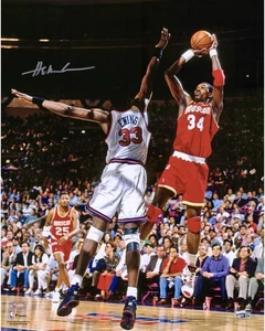 Hakeem Olajuwon Houston Rockets Autographed 16" x 20" Jumping Photograph - Picture 1 of 1