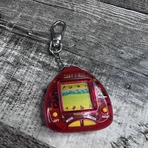 Vintage 1997 Giga Pets Baby T-Rex Tiger Electronic Red Virtual Pet Jurassic - Picture 1 of 6