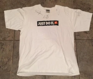 NIKE "JUST DO IT" SHIRT SIGNED BY JOHN CALIPARI - Picture 1 of 3
