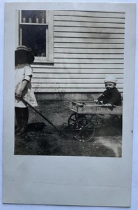 RPPC Real Photo Postcard - Little Girl Pulling Boy In Wagon  - Picture 1 of 2