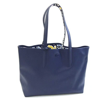 Bolso tote colaboración Lacoste Keith Haring en PVC azul marino y cuero. Foto 1 de 4