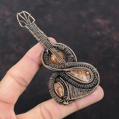 Venta de Halloween Piedra Solar Cobre Aniversario Alambre Envuelto Guitarra Nuevo Colgante Foto 1 de 4