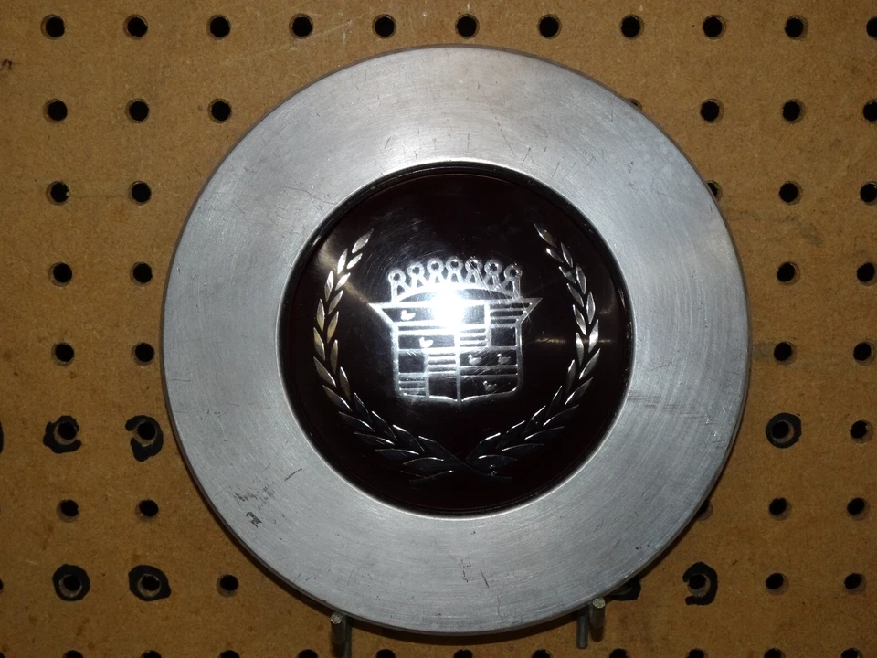 1989-1991 Cadillac Seville Machined With Dark Red center wheel center cap OEM - Image 1 of 4
