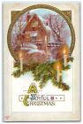 Carte postale antique gaufres maison bougies feuilles de pin de Noël 1911 couverte de neige