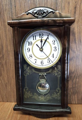 Vintage Pendulum Wall Clock Quartz 15' Tall Plastic Frame - Image 1 of 4