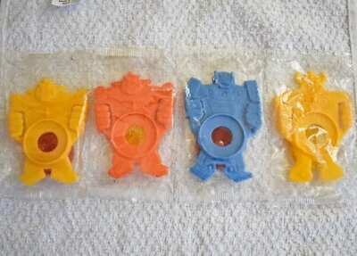 Caja de cereales Kellogg 1985 vintage juguetes 4 transformadores robot bicicleta reflectores de radios Foto 1 de 4