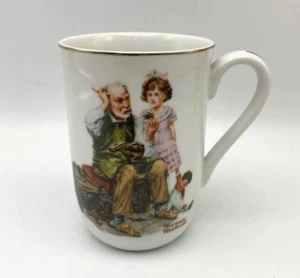 Norman Rockwell, The Cobbler Mug, gold trimmed. Used In Good Condition. - Picture 1 of 4