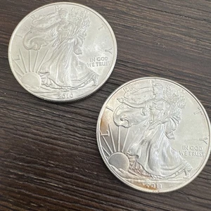 Lot of 2 - 2010-2011 $1 American Silver Eagles - 1 Oz - 99.9% - Lot ASE1052 - Picture 1 of 20