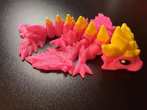 Wyverne articulée bébé cristal dragon 5,5 pouces rose et jaune - Photo 1 sur 4