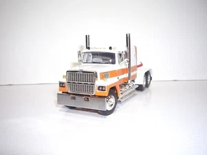 DCP FIRST GEAR 1/64 ORANGE AND WHITE FORD LTL 9000 WITH 60" FT SLEEPER - Picture 1 of 5
