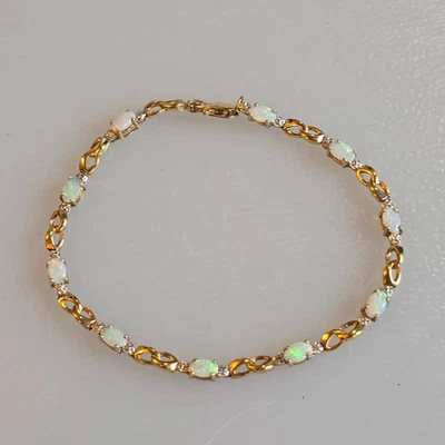 10k Natural white opal link Bracelet, 6.75 in. 3.74 Grams green red flashes - Image 1 of 4
