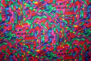 PABLOS PUZZLE IN RED, YELLOW, GREEN AND BLUE FROM HOFFMAN - 100% COTTON FABRIC - Picture 1 of 5