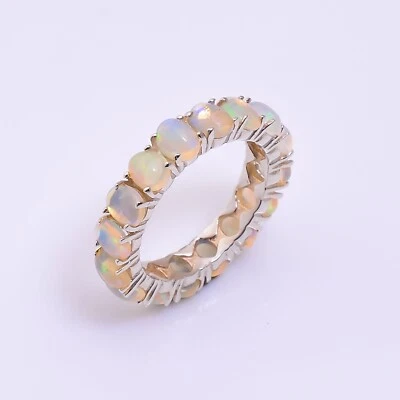 Anillo banda de eternidad de plata de ley 925 con piedras preciosas ovaladas de ópalo de fuego natural para mujer Foto 1 de 3