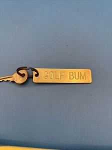 Llavero vintage Lowell Sigmund, Inc. 1979 latón golf vagabundo novedad - Imagen 1 de 5