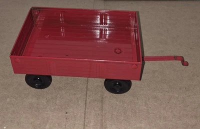 Remolque ERTL rojo de acero prensado con eje delantero giratorio de colección 74-7650 Foto 1 de 4