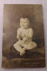 Real Photo Postcard Smiling Happy Baby With Toy Rattle Fischer Studios Marietta - Picture 1 of 10