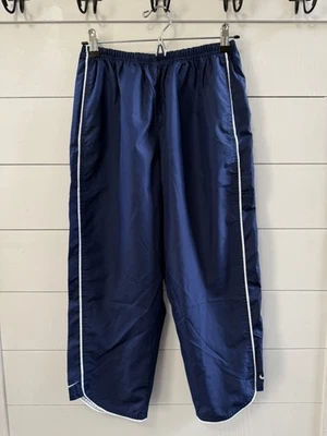 Pantalón de chándal vintage Y2K etiqueta plateada Nike capris para mujer bolsillos azules medianos Foto 1 de 4