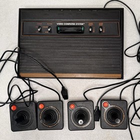 Atari 2600 4 Switch Woodgrain with 4 Controllers Untested No Power Cord