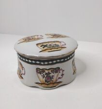  Porcelain round  Trinket Box,Tea cups  Flowers on Lid and Sides gold accents.