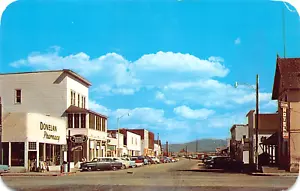 Saratoga WY Bridge Street Business District autos antiguos y farmacia, postal - Imagen 1 de 2