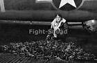 WW2 Picture Photo B17 Gunner With a Pile 50 Caliber Shells After Battle 3251