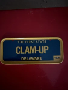 BICYCLE LICENSE PLATE 1990 DELAWARE CLAM-UP THE FIRST STATE TIN 2" × 5" - Picture 1 of 2