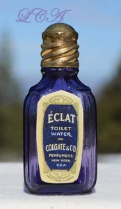 Pequeño BOTELLA DE PERFUME COLGATE púrpura mini ECLAT con TAPA DE LATÓN de JUEGO INFANTIL - Imagen 1 de 4